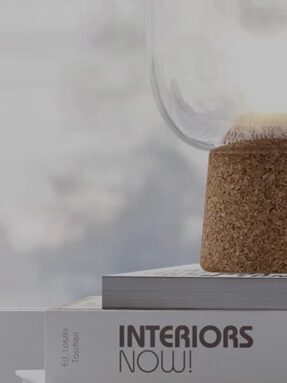 A close up of a cork container on top of a book