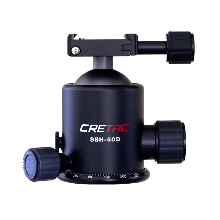 A camera tripod with a ball head and a quick release plate.