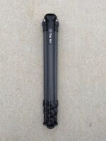 A black pole with some type of object on it