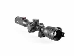 A rifle scope with a red dot sight on it.
