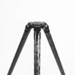 A tripod with three legs and one arm extended.