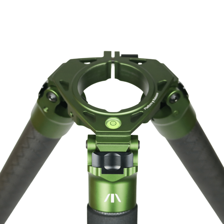 A green tripod with two arms and one arm holding the camera.