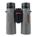 A pair of binoculars with an orange ring on the side.