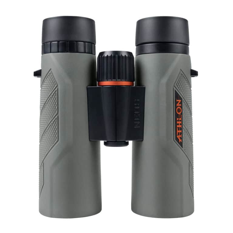 A pair of binoculars with an orange ring on the side.