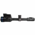 A rifle scope with blue ring on it.