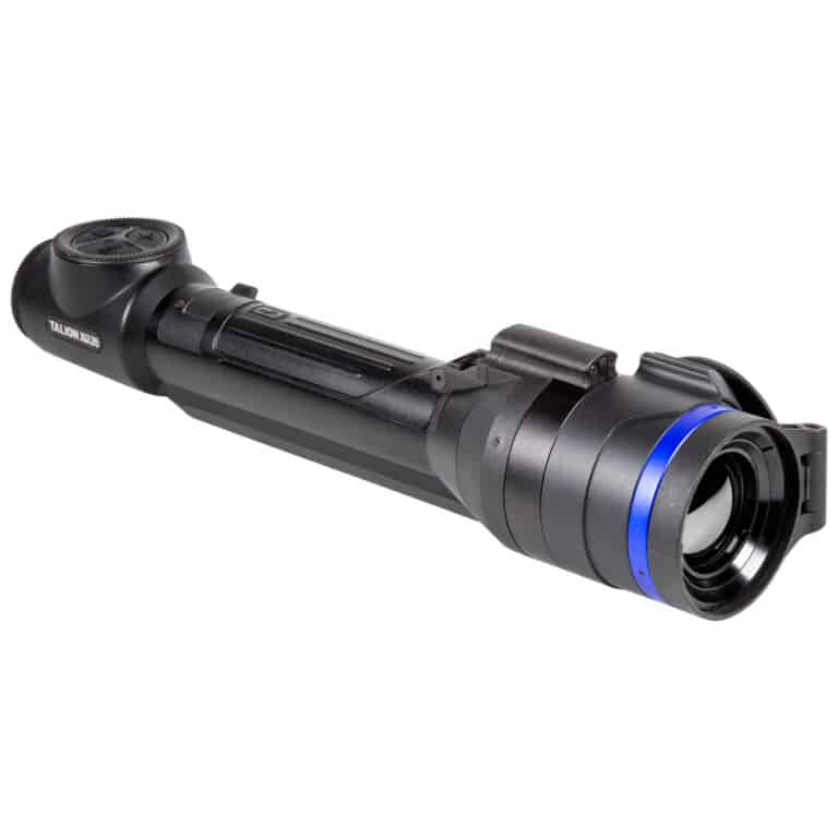 A black and blue flashlight is on the ground.