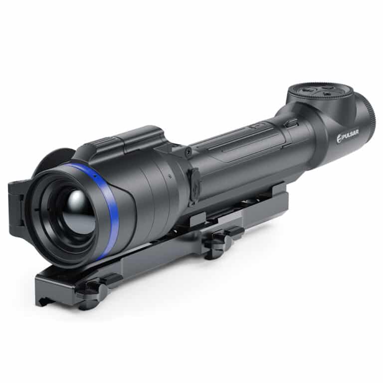 A rifle scope with blue ring on it.