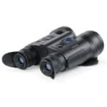A pair of binoculars sitting on top of a white table.