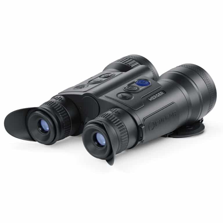 A pair of binoculars sitting on top of a white table.