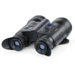 A pair of binoculars sitting on top of a white table.