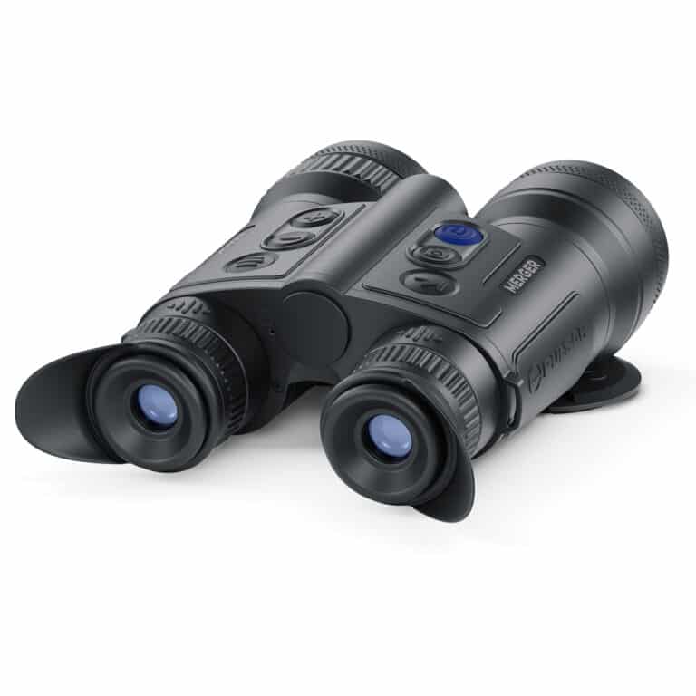 A pair of binoculars sitting on top of a white table.