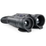 A pair of night vision goggles on top of a white table.