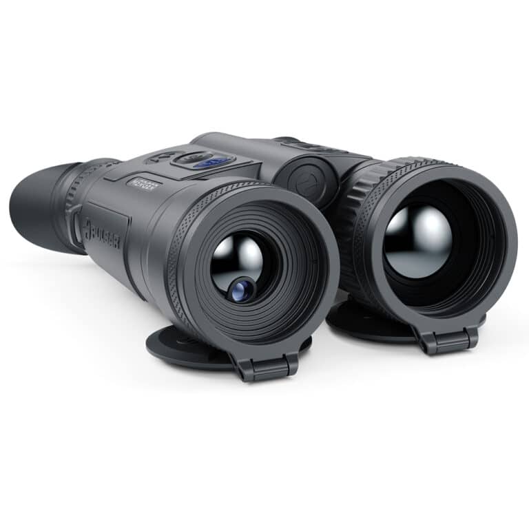 A pair of night vision goggles on top of a white surface.