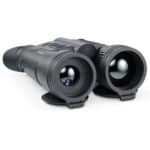 A pair of binoculars sitting on top of a white table.