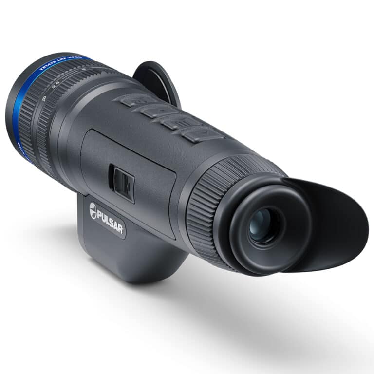 A camera with an attached lens and tripod.