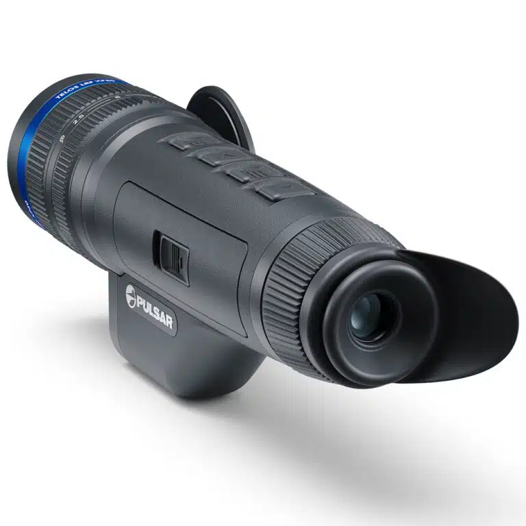 A camera with an attached lens and tripod.