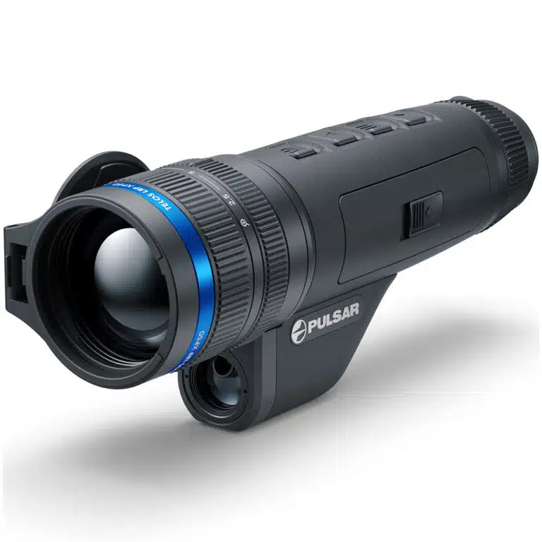 A black and blue camera is on the ground