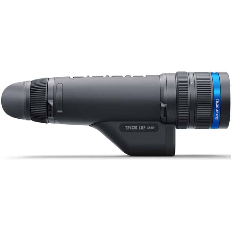 A black and blue camera is on the side of a white wall.