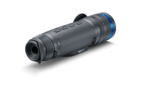 A black and blue camera is on the ground