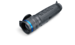 A black and blue flashlight is on the ground.