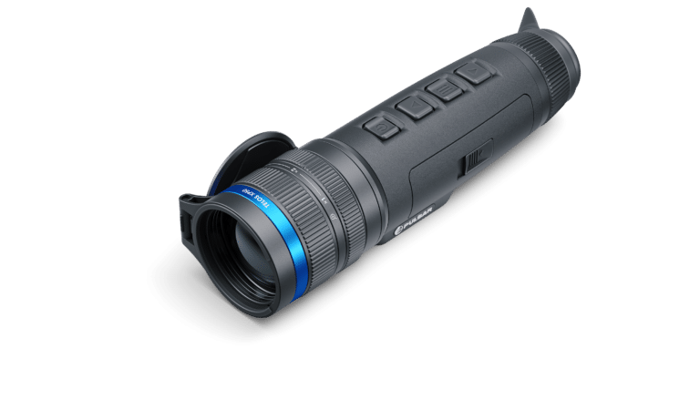 A black and blue flashlight is on the ground.