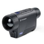 A black and blue camera is on the ground