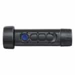 A black and blue flashlight is on the side of a white wall.