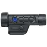 A black and blue camera is on the side of a white wall.