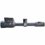 A rifle scope with a blue dot on it.
