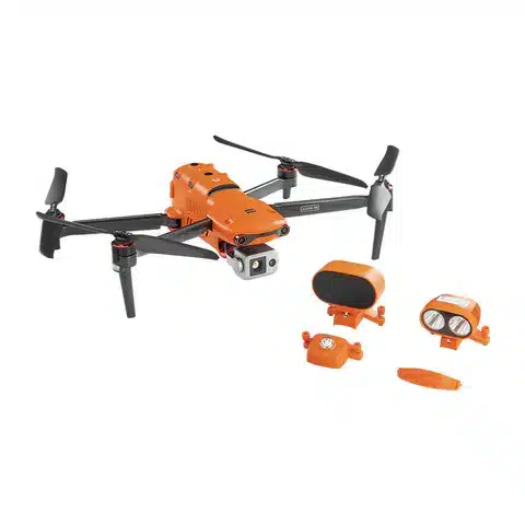 A small orange and black drone with some parts missing.