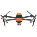 A small orange and black drone with camera attached.