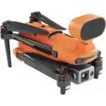 A orange and black camera with a handle attached to it.