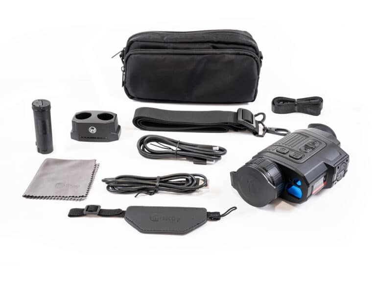 A set of various items that include a camera, charger and case.