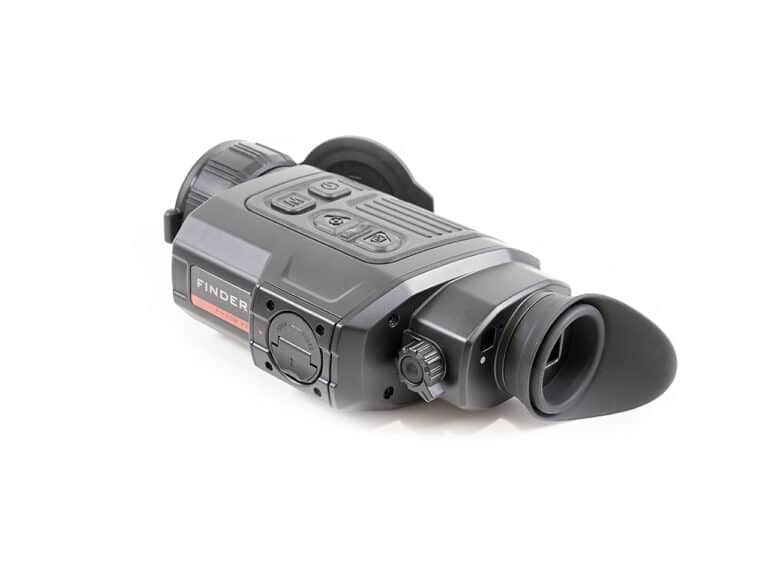 A video camera is shown with the lens open.