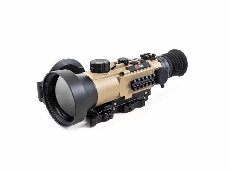 A rifle scope with an attached camera.