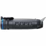 A black and blue flashlight is on the ground.
