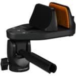 A black and orange phone holder attached to the side of a car.
