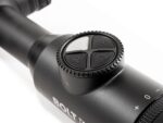 A close up of the scope on a rifle