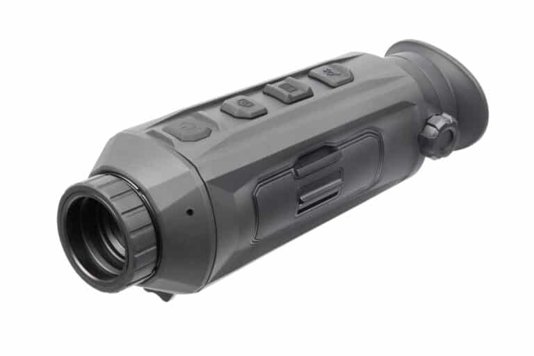 A black and gray camera with a lens attached to it.