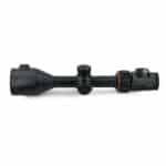 A black scope with red accents on top of it.