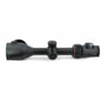 A black scope with red accents on top of it.