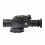 A black and red camera is on the ground