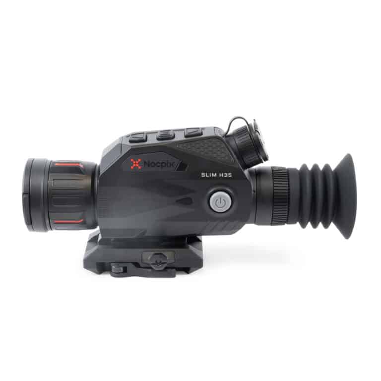 A black and red camera is on the ground