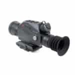 A night vision scope is shown with the sight on.