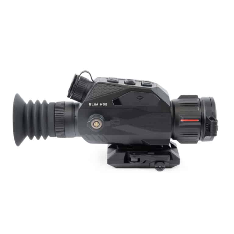 A black and red camera with a lens attached to it.