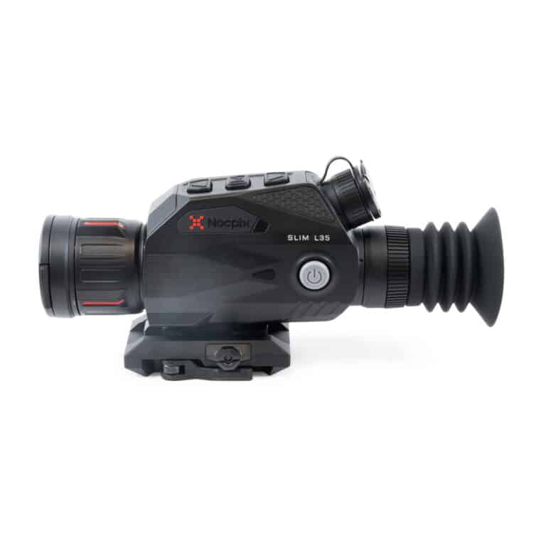 A black and red camera is on the ground