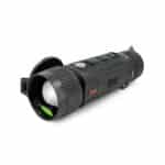 A black flashlight with green light on top of it.