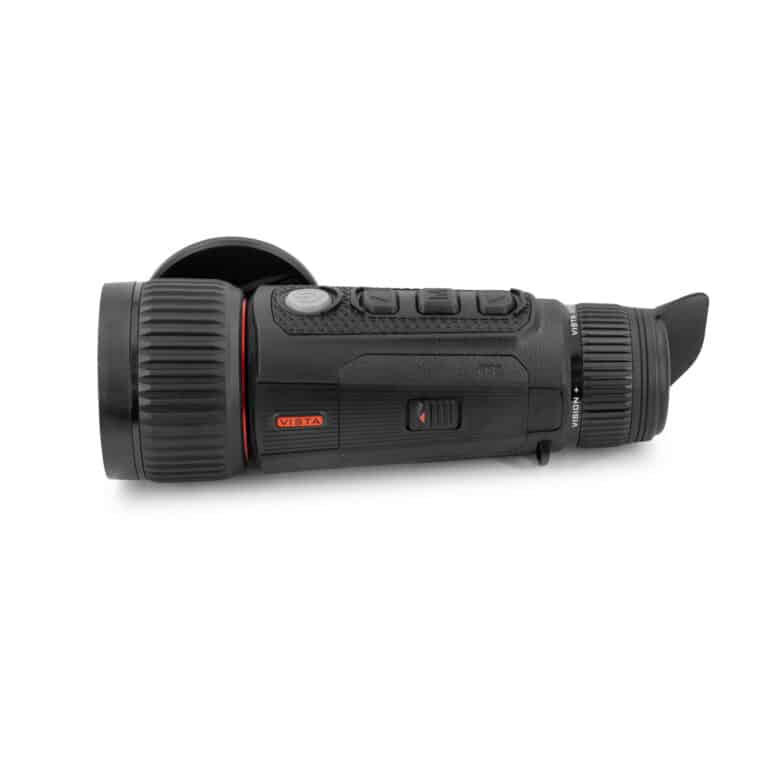 A black and red camera is on the ground