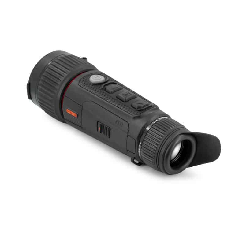A black and red camera is on the ground