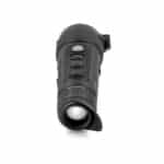 A black flashlight is on the ground.